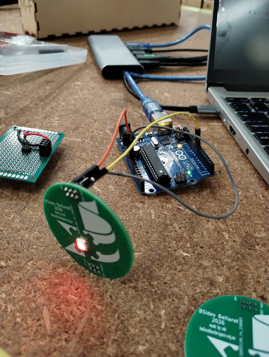 Photo of the SAO board powered on, showing the RGB LED lit up